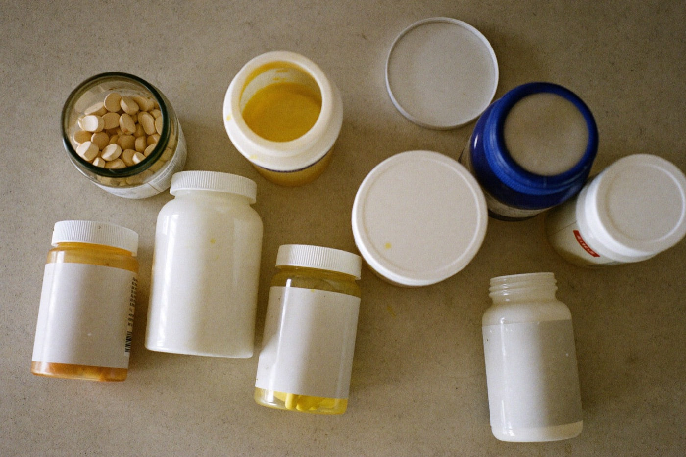 A cabinet of half-used supplement jars